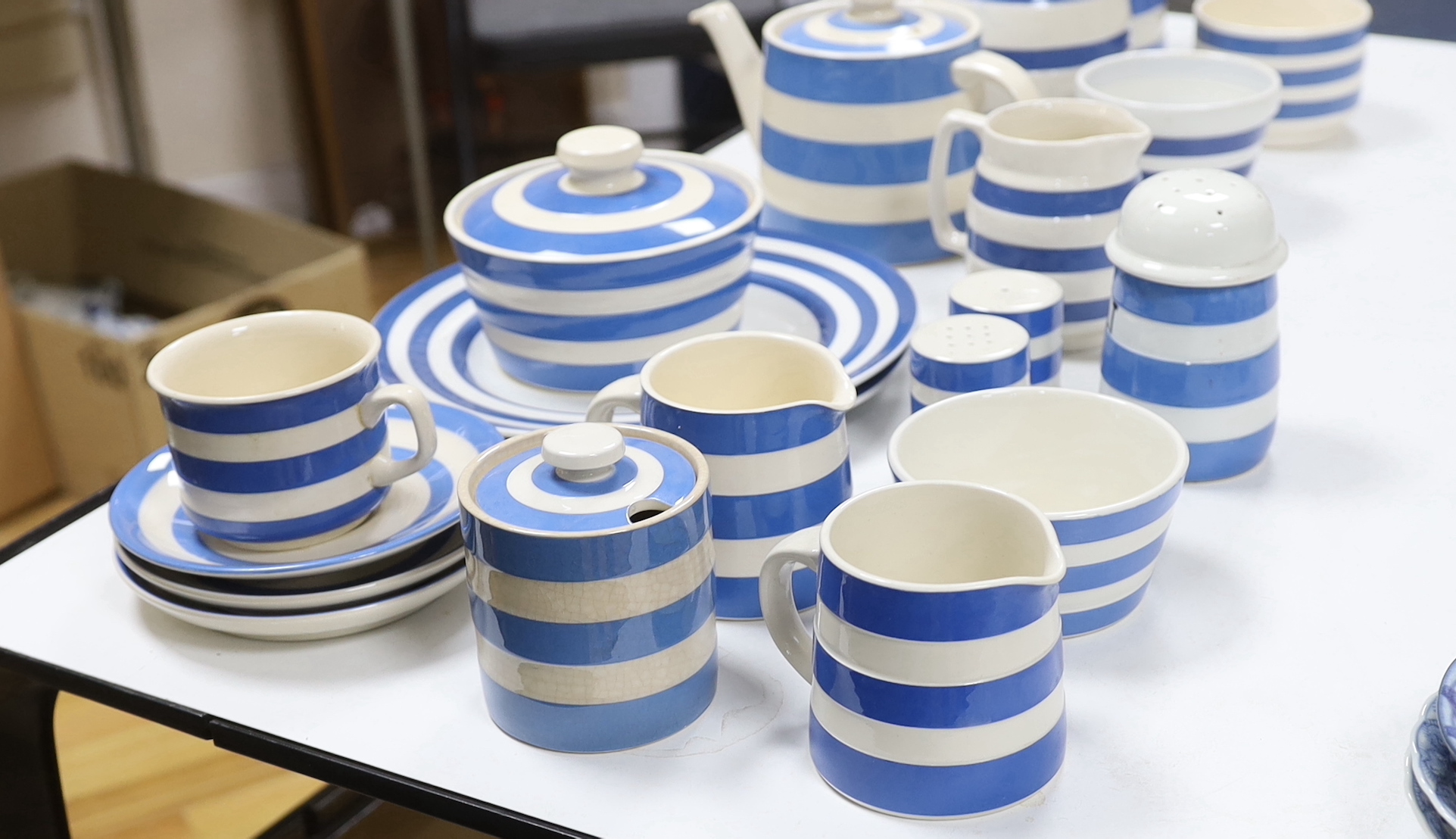 T.G. Green and other Cornishware including; a teapot, two large jugs and three smaller jugs, salt and pepper shakers, plates and bowls, etc. (19)